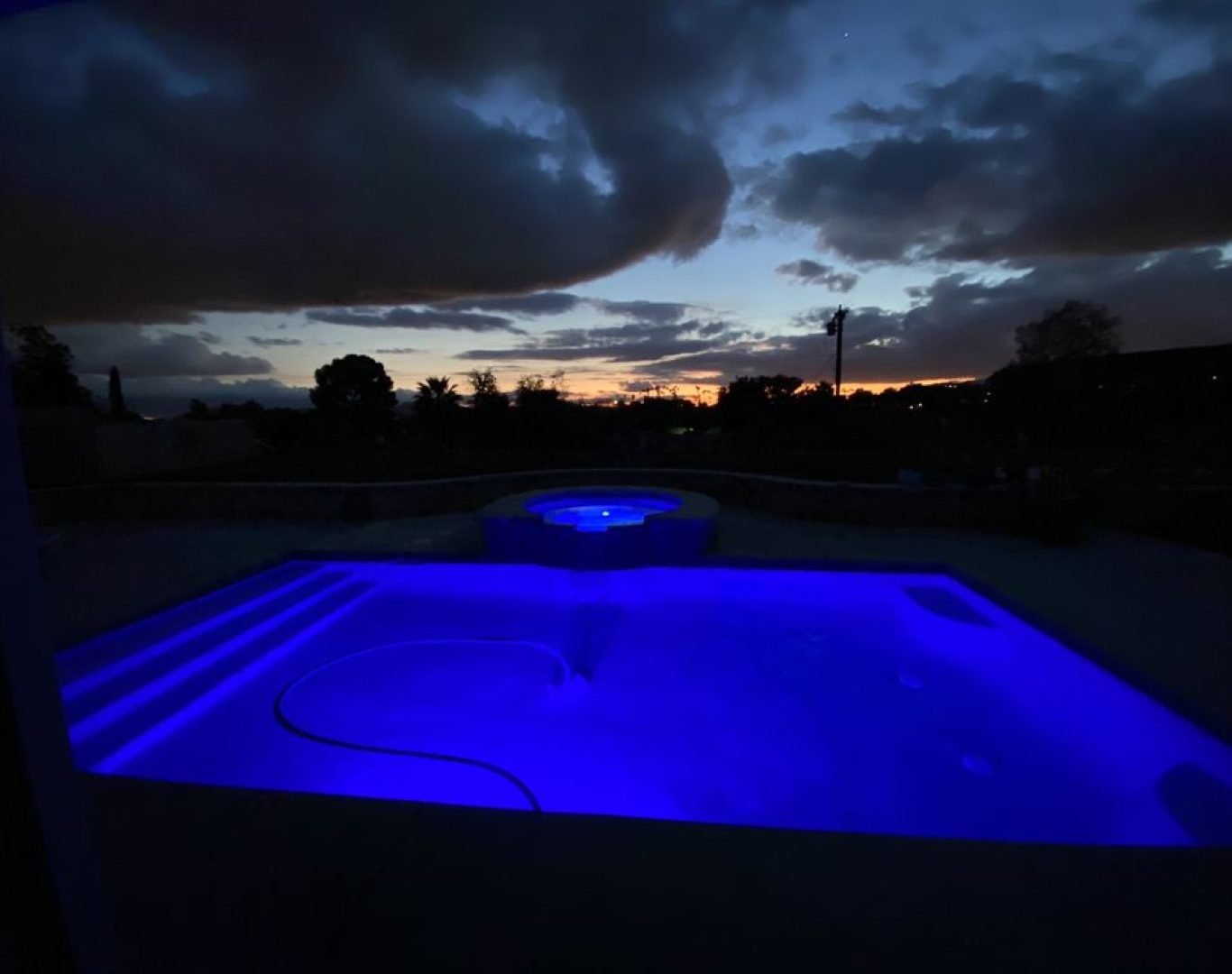 Southern-California-Backyard-Pool-lit-with-blue-LED-light
